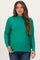 woman wearing a green long sleeve maternity sweater with a high neck and relaxed fit, showing her baby bump