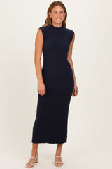 woman wearing a navy blue ribbed sleeveless midi dress with a high neckline and fitted silhouette