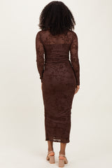 woman wearing a brown long sleeve floral lace bodycon dress, viewed from the back