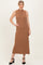 woman wearing a ribbed sleeveless brown maxi dress styled with black ankle strap heels