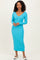 woman wearing a long sleeve turquoise ribbed midi dress with a v-neckline and fitted silhouette
