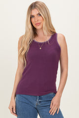 woman wearing a purple tank top with contrasting stitching and paired with blue jeans