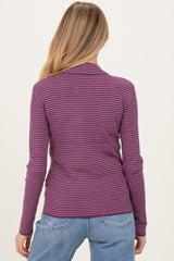 woman wearing a purple and pink striped long sleeve maternity top, showing the back view