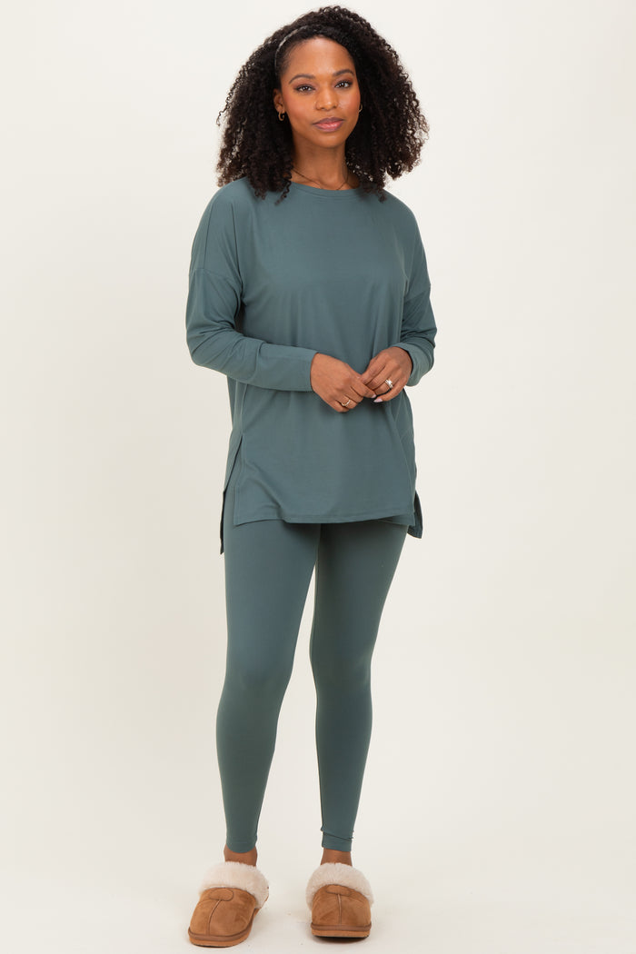 woman wearing a teal long sleeve tunic top and matching leggings, styled for a comfortable loungewear look