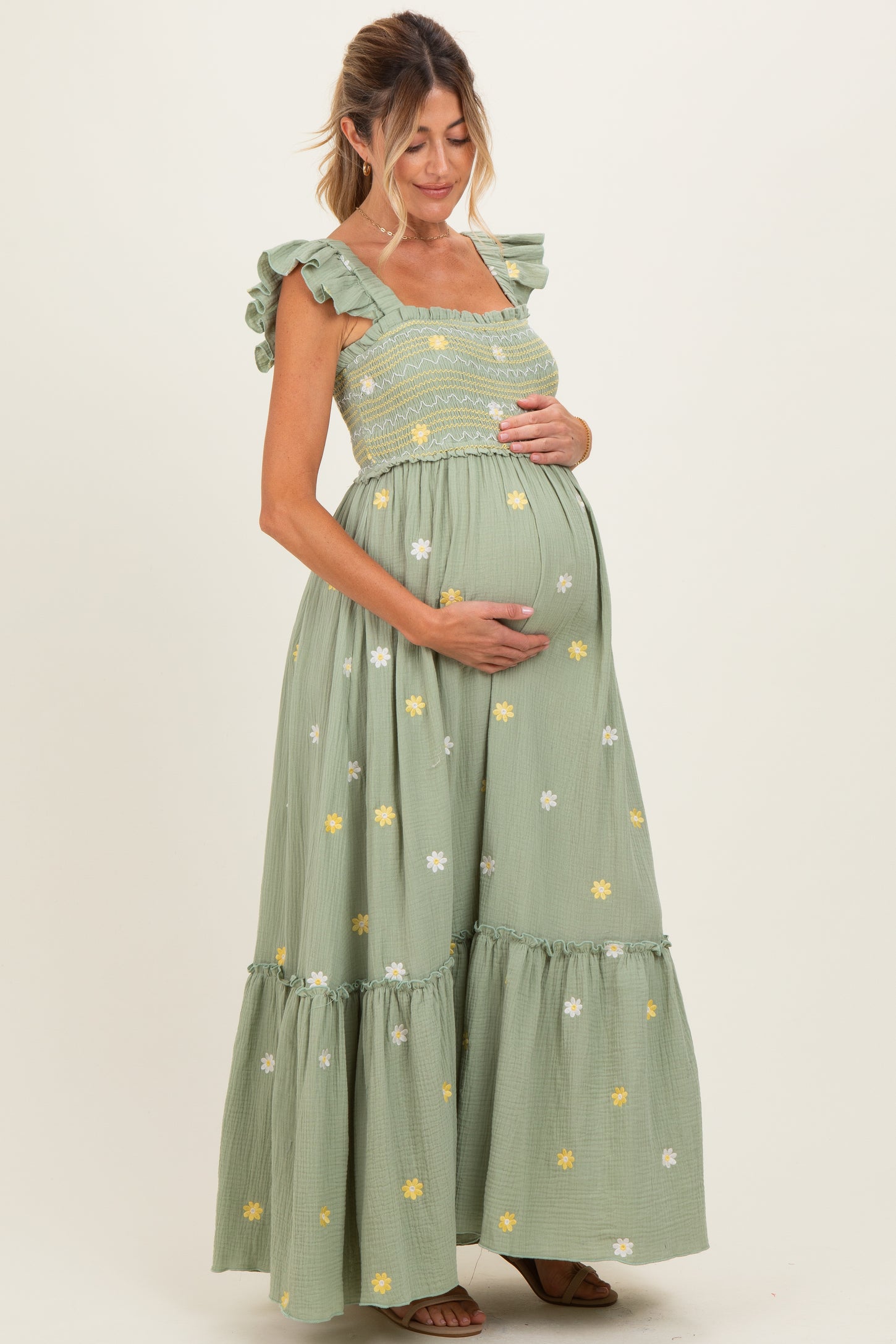 green floral maternity dress Pine Cotton This style features a modern cowl neckline and inverted pleats on the front of the skirt that helps add extra room to your growing bump Hope & Ivy Samantha Flutter