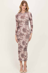 woman wearing a long sleeve brown and cream tie-dye midi dress with a fitted silhouette