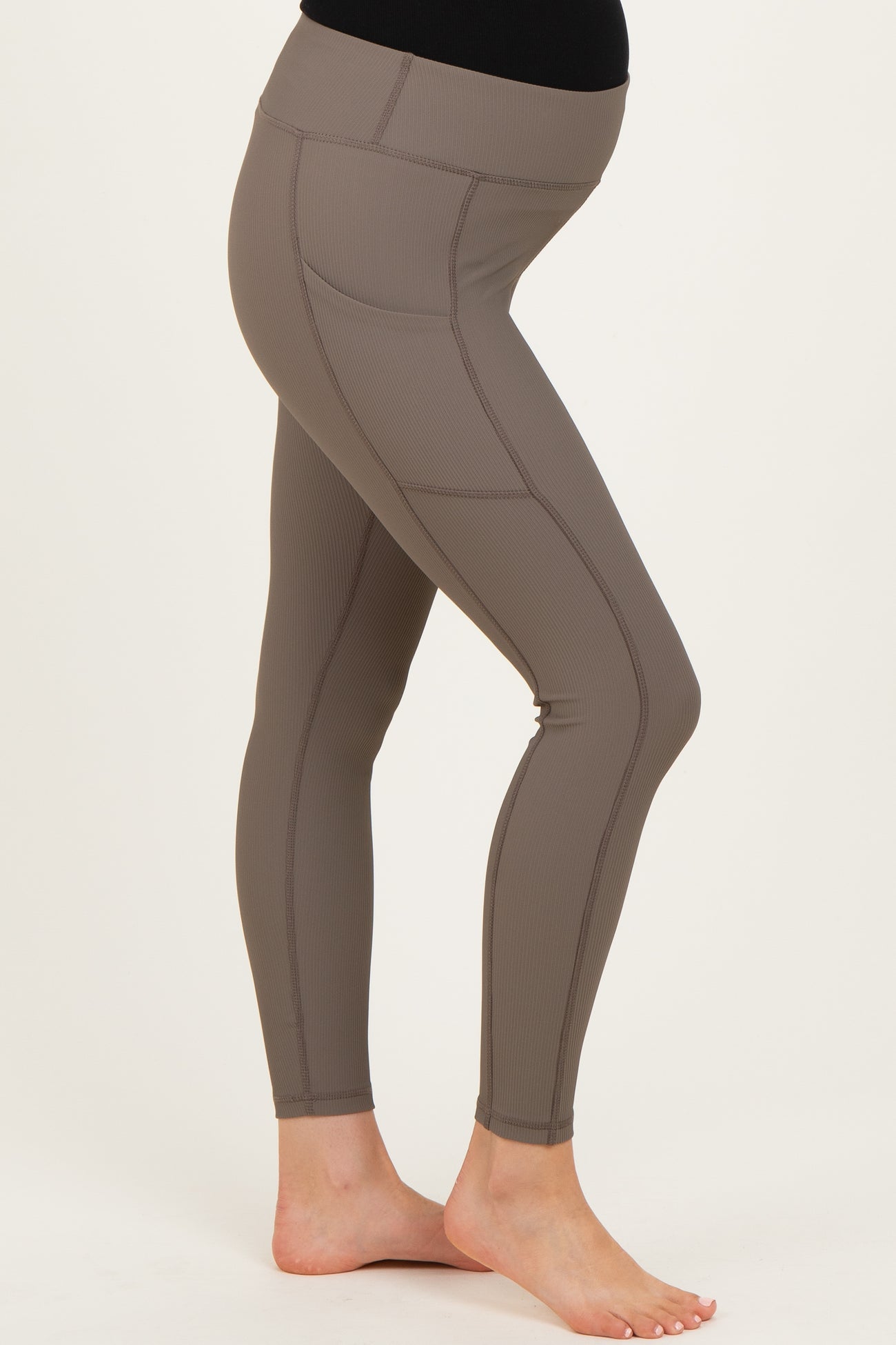 maternity wear taupe high-waisted leggings with seam detailing and a supportive waistband, model showing baby bump
