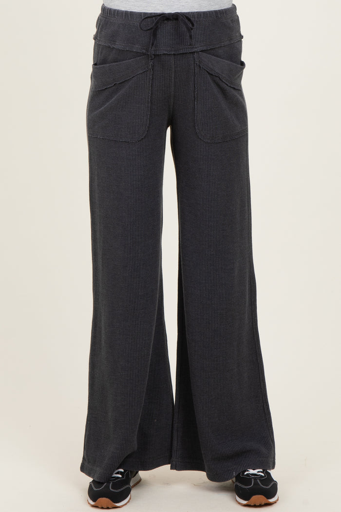maternity wear in dark gray wide-leg pants with drawstring and front pockets, styled with a casual top