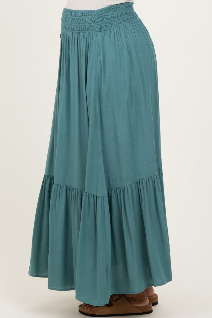 maternity wear teal maxi skirt with tiered ruffles and elastic waistband, styled with sandals