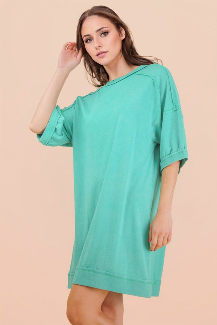 woman wearing a relaxed fit mint green oversized t-shirt dress with short sleeves