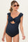 woman wearing a navy blue maternity one-piece swimsuit with ruffle sleeves and a front tie detail, showing her baby bump