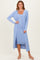 woman wearing a light blue ribbed long cardigan over a matching midi dress with a square neckline