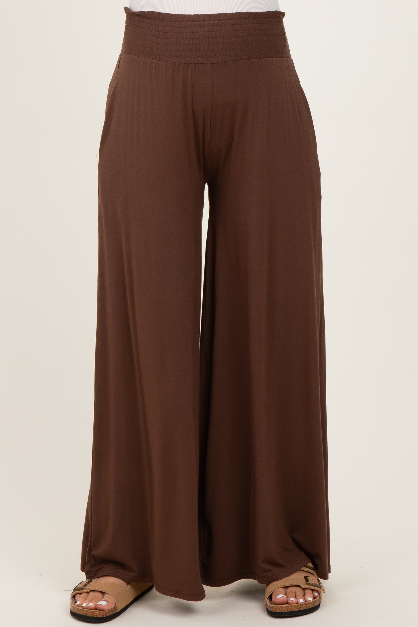 brown maternity wide-leg pants with a smocked waistband and side pockets