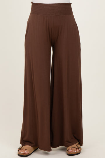brown maternity wide-leg pants with a smocked waistband and side pockets