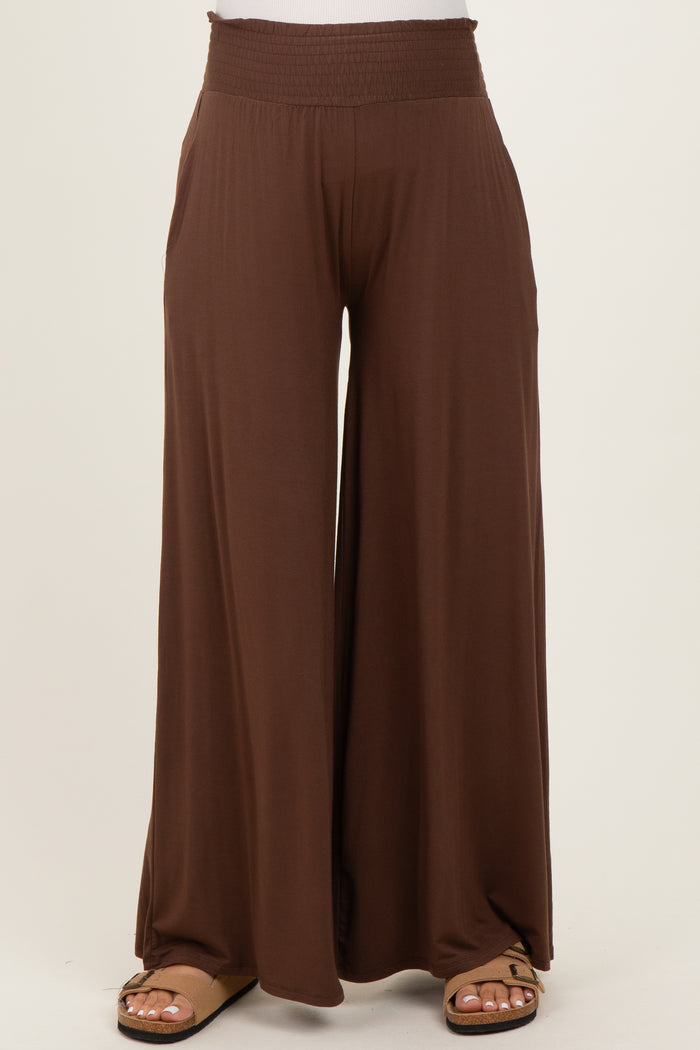 brown maternity wide-leg pants with a smocked waistband and side pockets