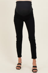 woman wearing black maternity skinny jeans with a stretchy over-the-bump waistband