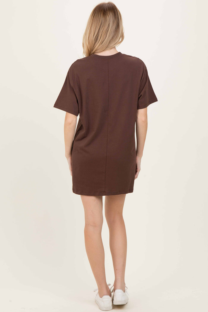 woman wearing a brown short sleeve casual dress, shown from the back, with a relaxed fit and above-the-knee length