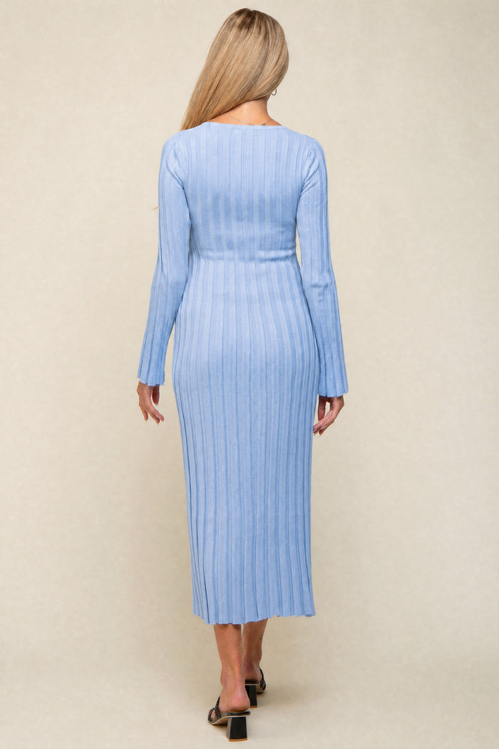 woman wearing a light blue ribbed maternity dress with long sleeves, fitted silhouette, and midi length from the back