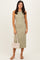 woman wearing a sleeveless olive green midi dress and holding a woven handbag