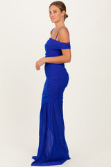 woman wearing a royal blue off-the-shoulder evening gown with ruched details and a flowing skirt