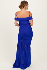 woman wearing a royal blue off-the-shoulder gown with ruched details and a flowing skirt from the back