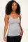 woman wearing a gray spaghettistrap tank top with a fitted style and curly hair