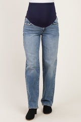 woman wearing blue maternity jeans with a dark blue over-the-bump panel and straight leg style