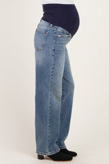 woman wearing maternity light wash wide-leg jeans with a comfortable waistband and visible baby bump