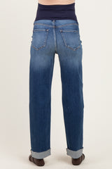 woman wearing a pair of cuffed light blue maternity jeans viewed from the back