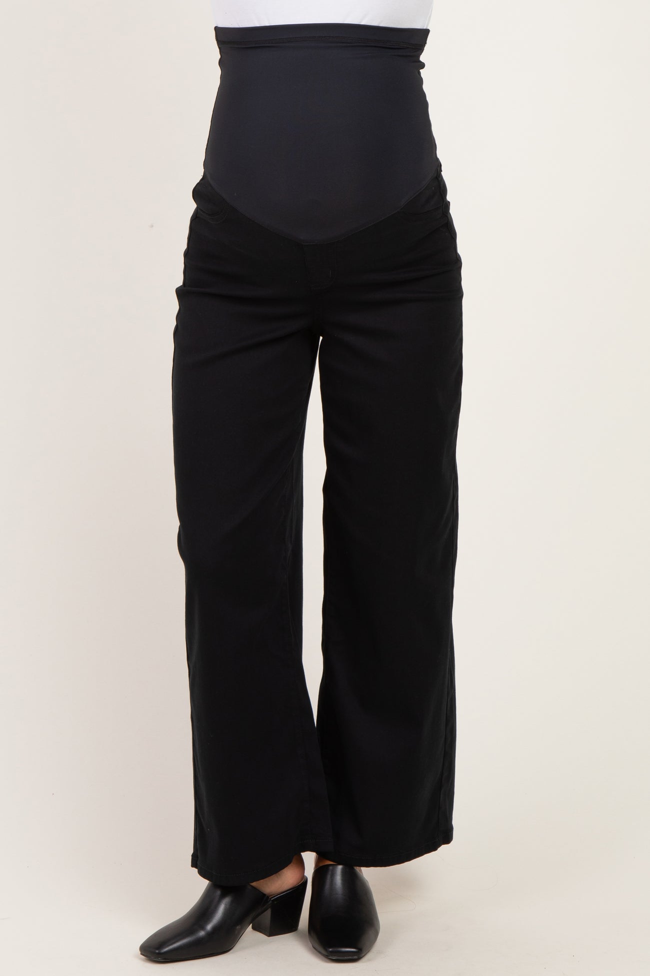 woman wearing black maternity wide-leg pants with a supportive over-the-bump waistband
