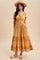 woman wearing a mustard yellow tiered midi dress with lace detailing and puff sleeves, accessorized with a straw hat