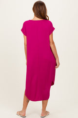 woman wearing a hot pink short sleeve maxi dress with a relaxed fit, viewed from the back