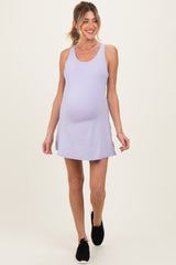 woman wearing a light purple maternity dress with a relaxed fit and a visible baby bump.