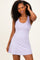 woman wearing a light purple sleeveless dress with a scoop neckline and a fitted silhouette