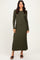 woman wearing a long sleeve olive green ribbed maxi dress with a fitted silhouette and side slits