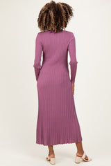 woman wearing a long purple ribbed maternity dress, view from the back, fitted style with long sleeves