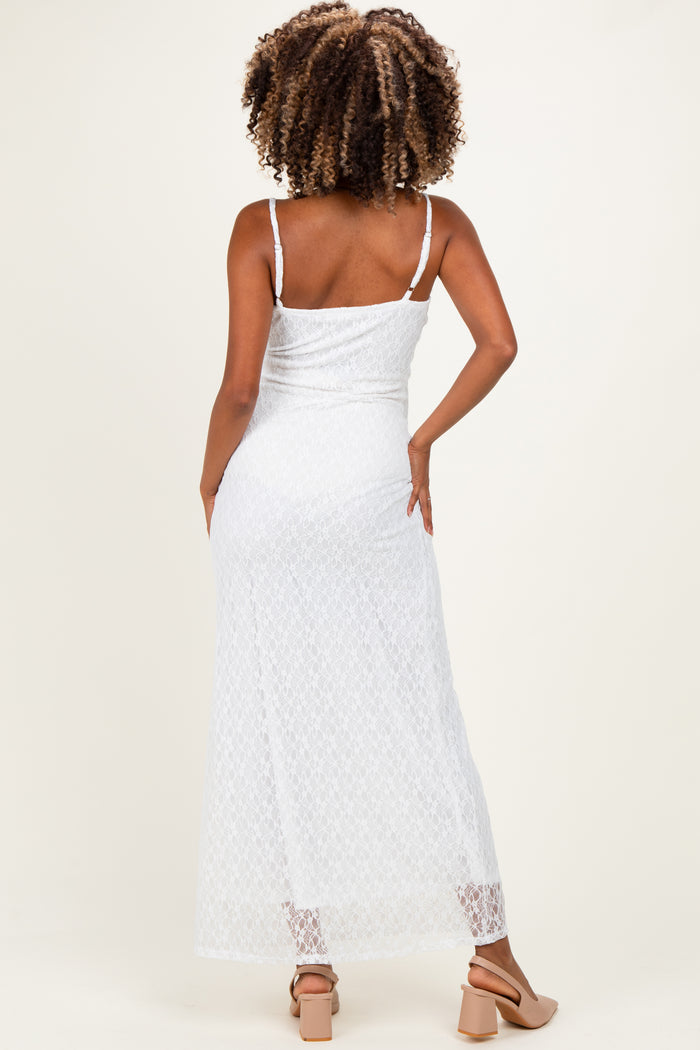 woman wearing a white lace maternity maxi dress with adjustable straps, showing the back view