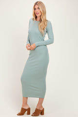 woman wearing a light green long sleeve ribbed maxi dress and brown heeled mules