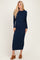 woman wearing a navy ribbed long sleeve maxi dress and brown heeled sandals