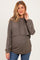 woman wearing a brown cropped maternity hoodie with a hood and long sleeves, showcasing her baby bump