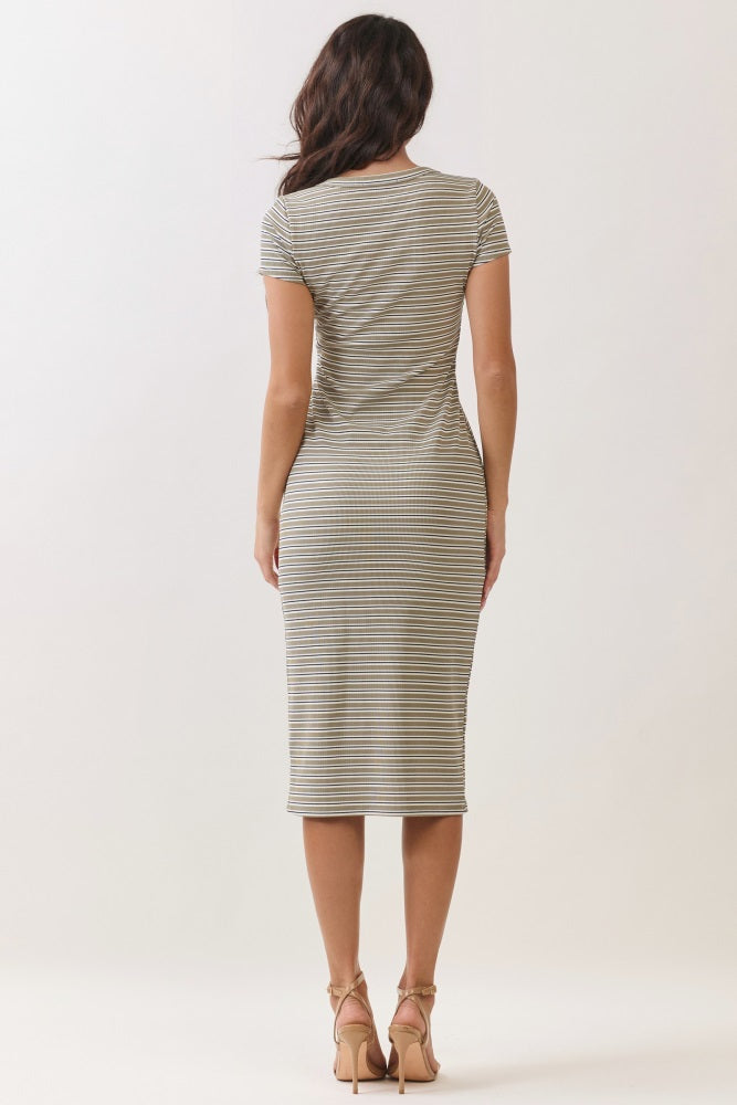 woman wearing a fitted striped midi dress with short sleeves and a scoop back