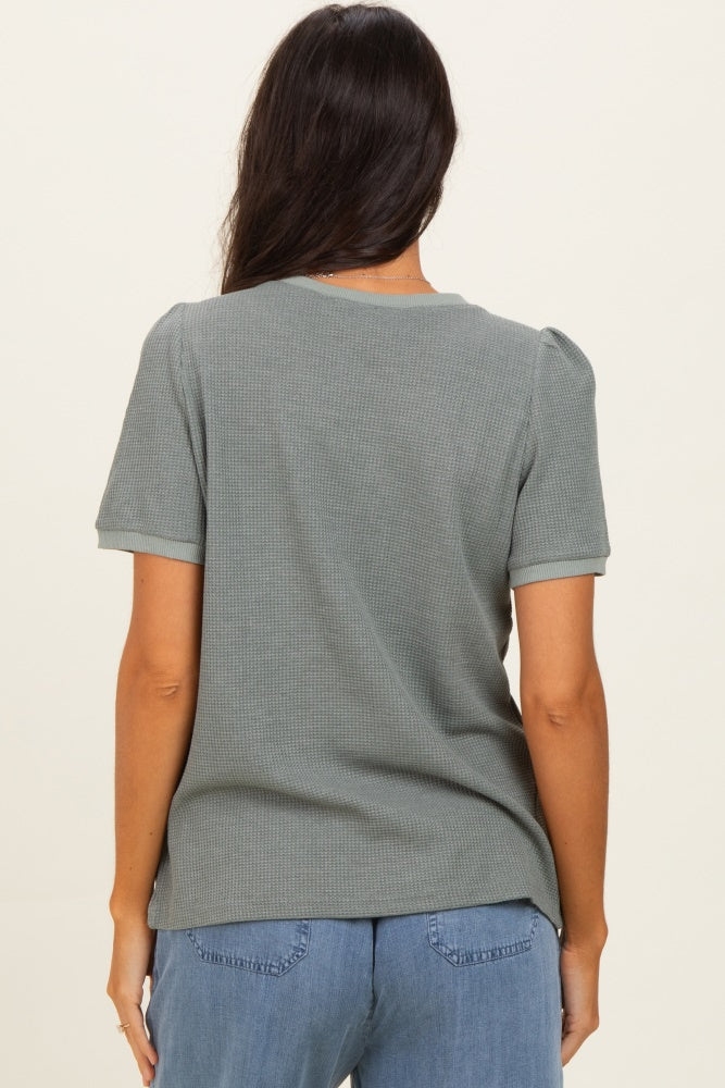 woman wearing a gray short sleeve ribbed top, shown from the back with soft puff sleeves