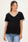 woman wearing a black maternity top with scalloped lace trim and short sleeves