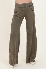 woman wearing olive green wide-leg maternity pants with an elastic waistband and side pockets