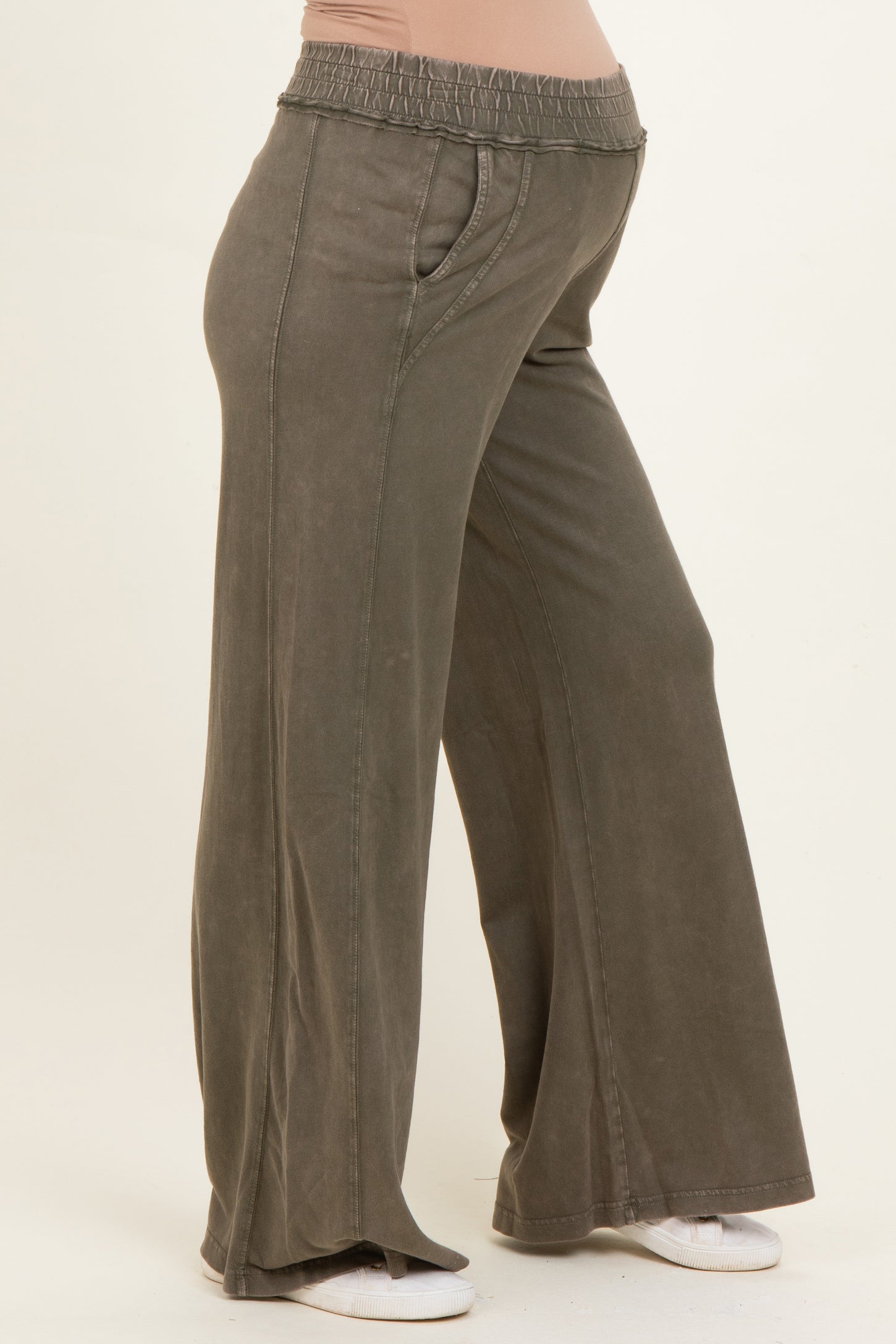 woman wearing olive green maternity wide-leg pants with an elastic waistband