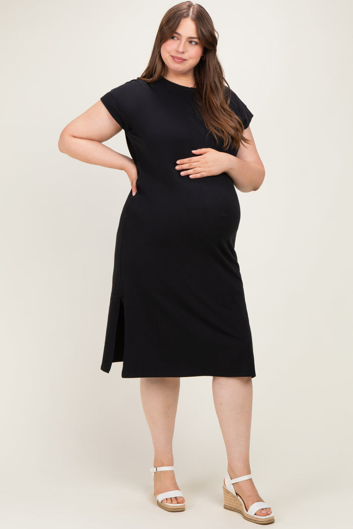 woman wearing a black short sleeve maternity dress with side slits and a visible baby bump