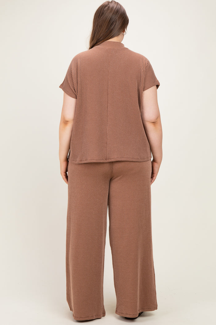 woman wearing a brown ribbed maternity plus lounge set, showing the back view of the top and wide-leg pants