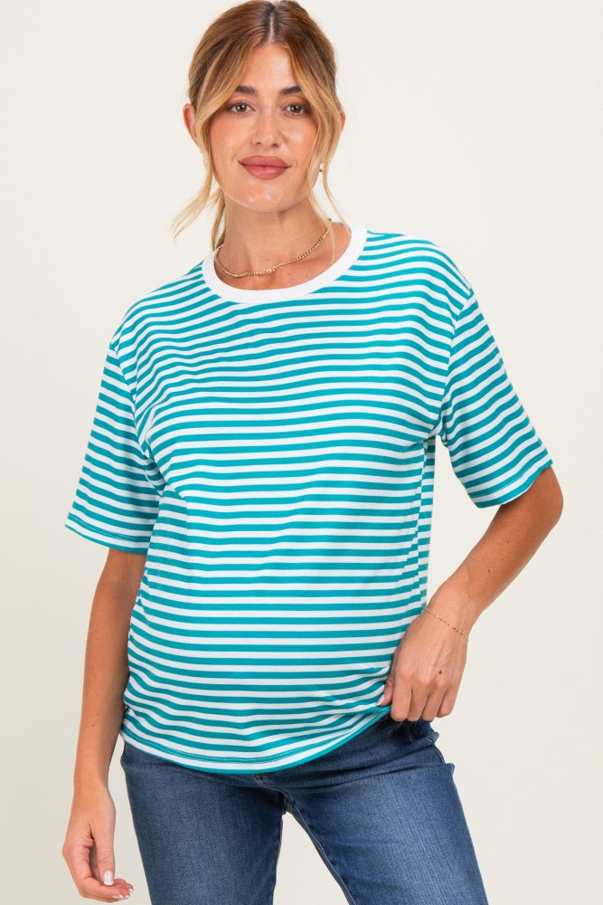 woman wearing a teal and white striped maternity t-shirt with a relaxed fit and a visible baby bump