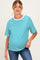 woman wearing a teal and white striped maternity t-shirt with a relaxed fit and a visible baby bump