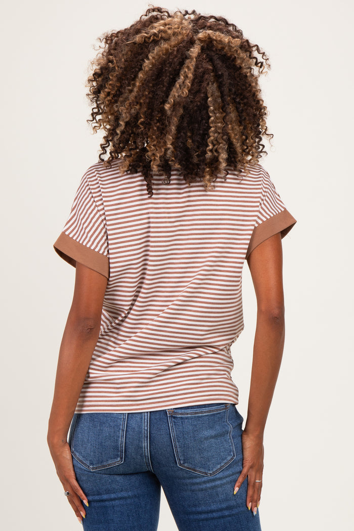 woman wearing a brown and cream striped maternity top with rolled sleeves and a relaxed fit from the back